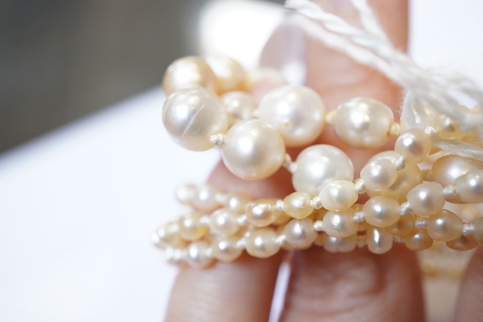 A natural pearl and diamond necklace, early 20th century